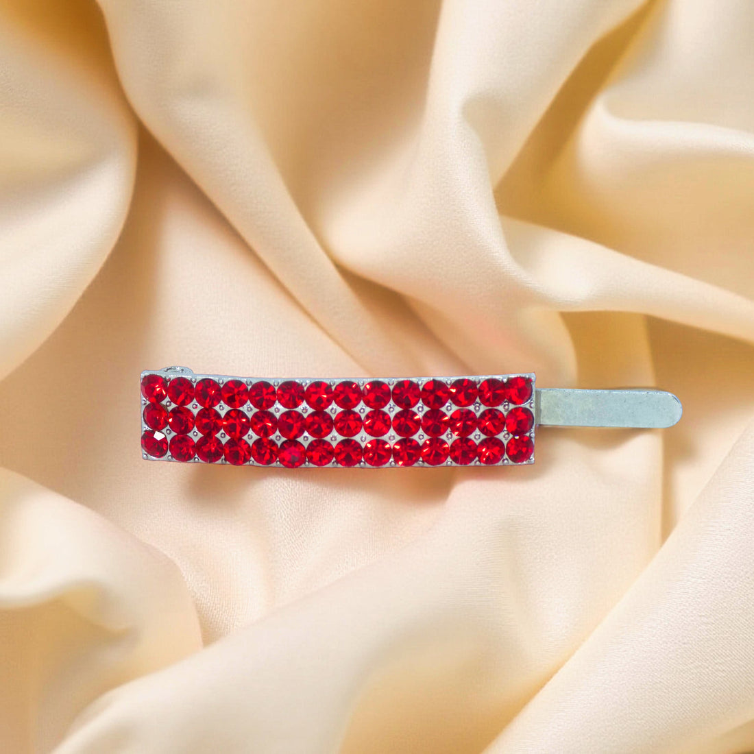 Haerime Magnetta Snap Clip in Red – angled close-up of ruby red crystals on silver arc, with soft-textured surface