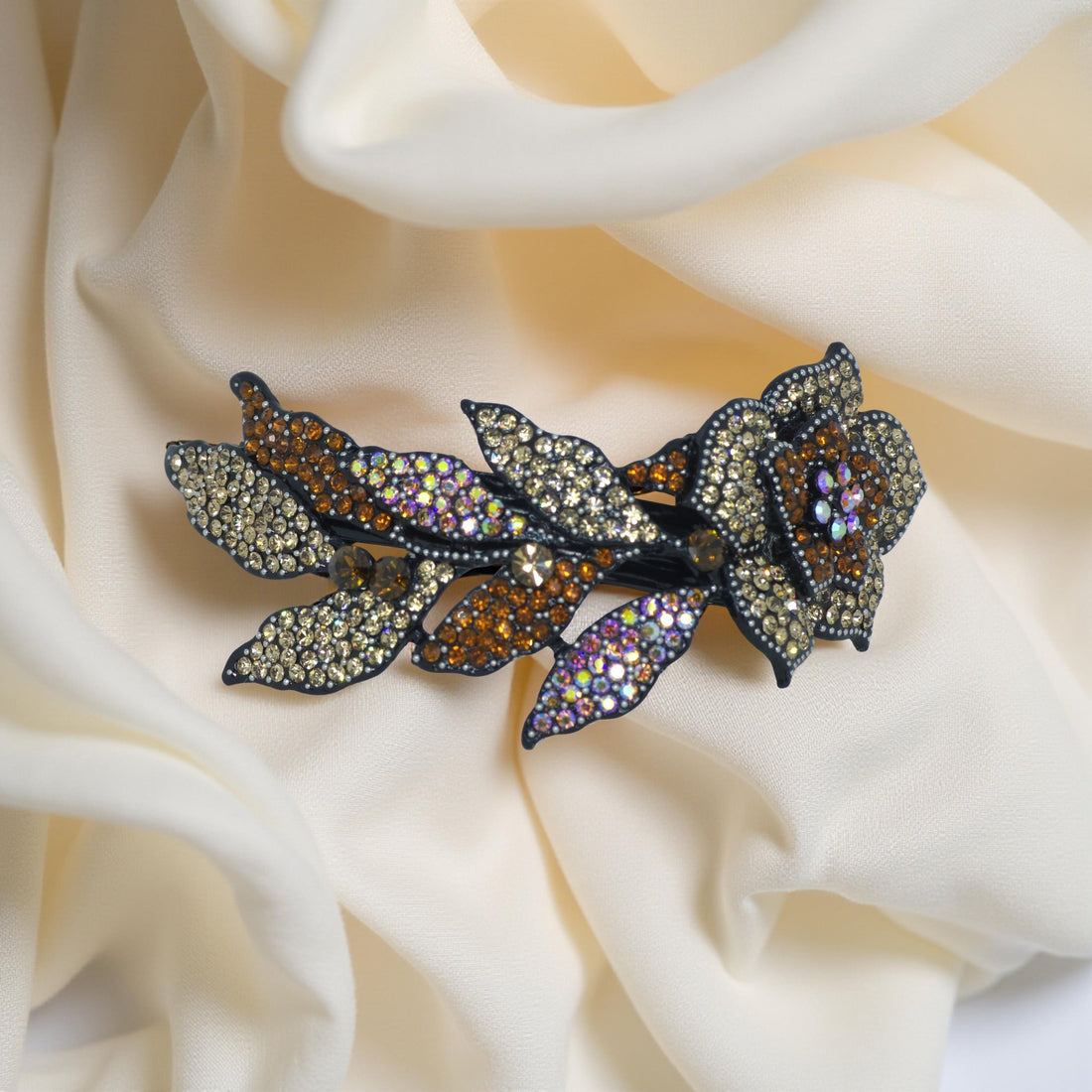 Haerime Midnight Bloom Barrette in Amber – zoomed detail of faceted amber and topaz stones with sculptural petals