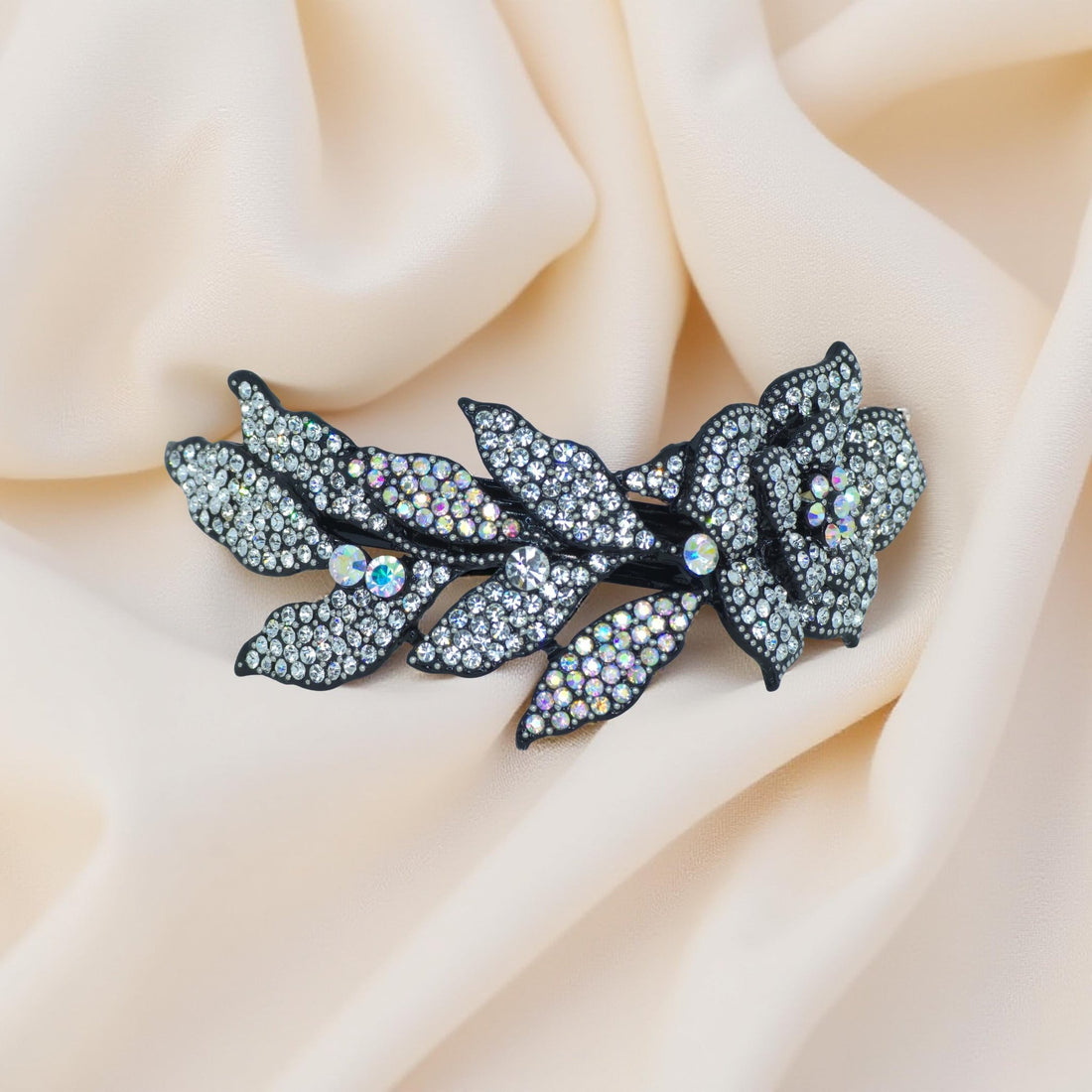 Haerime Midnight Bloom Barrette in Clear – close-up highlighting brilliant clear pavé petals with frosty silver leaf accents