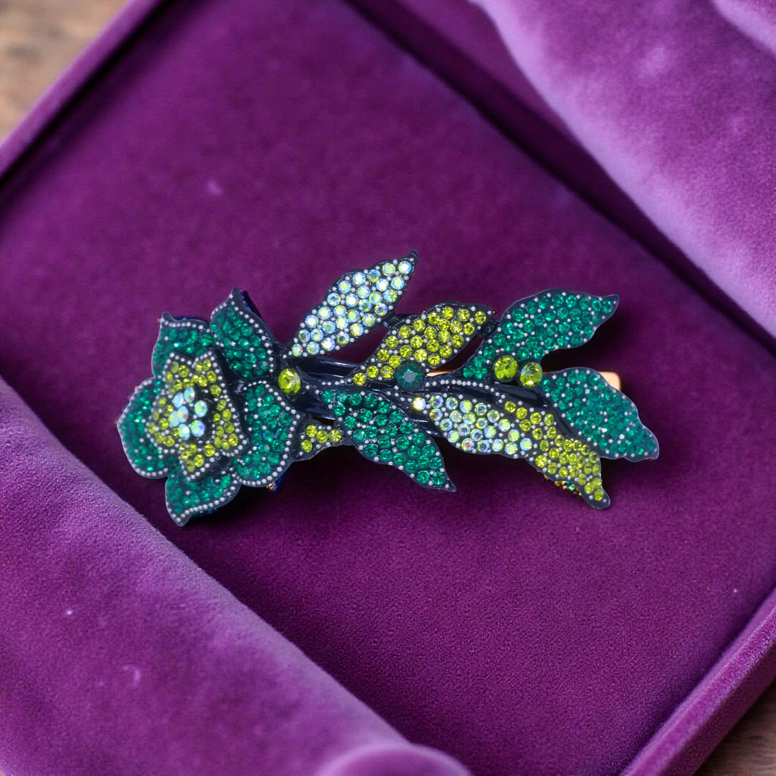 Haerime Midnight Bloom Barrette in Green – close-up of emerald-toned petals and pavé leaf pattern with rich botanical structure
