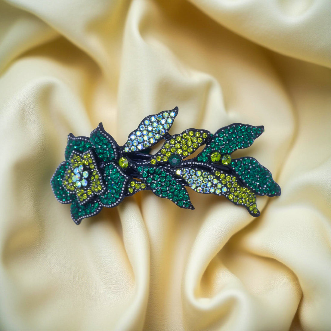 Haerime Midnight Bloom Barrette in Green – top view showcasing forest green crystal blossoms and curved floral arc