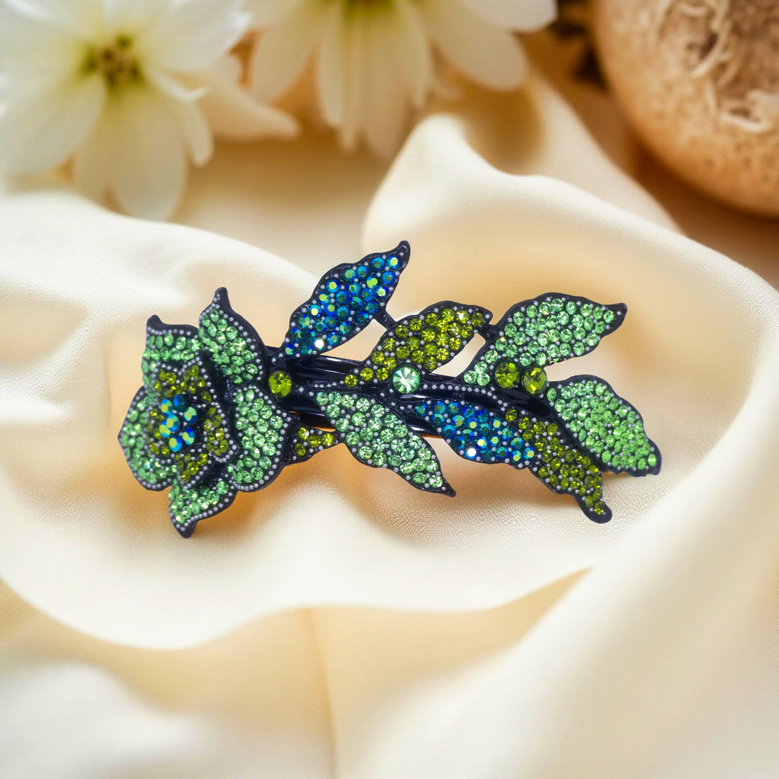 Haerime Midnight Bloom Barrette in Mint – curved floral clip with aqua crystal leaves and mint petals, shown on ivory satin in soft daylight