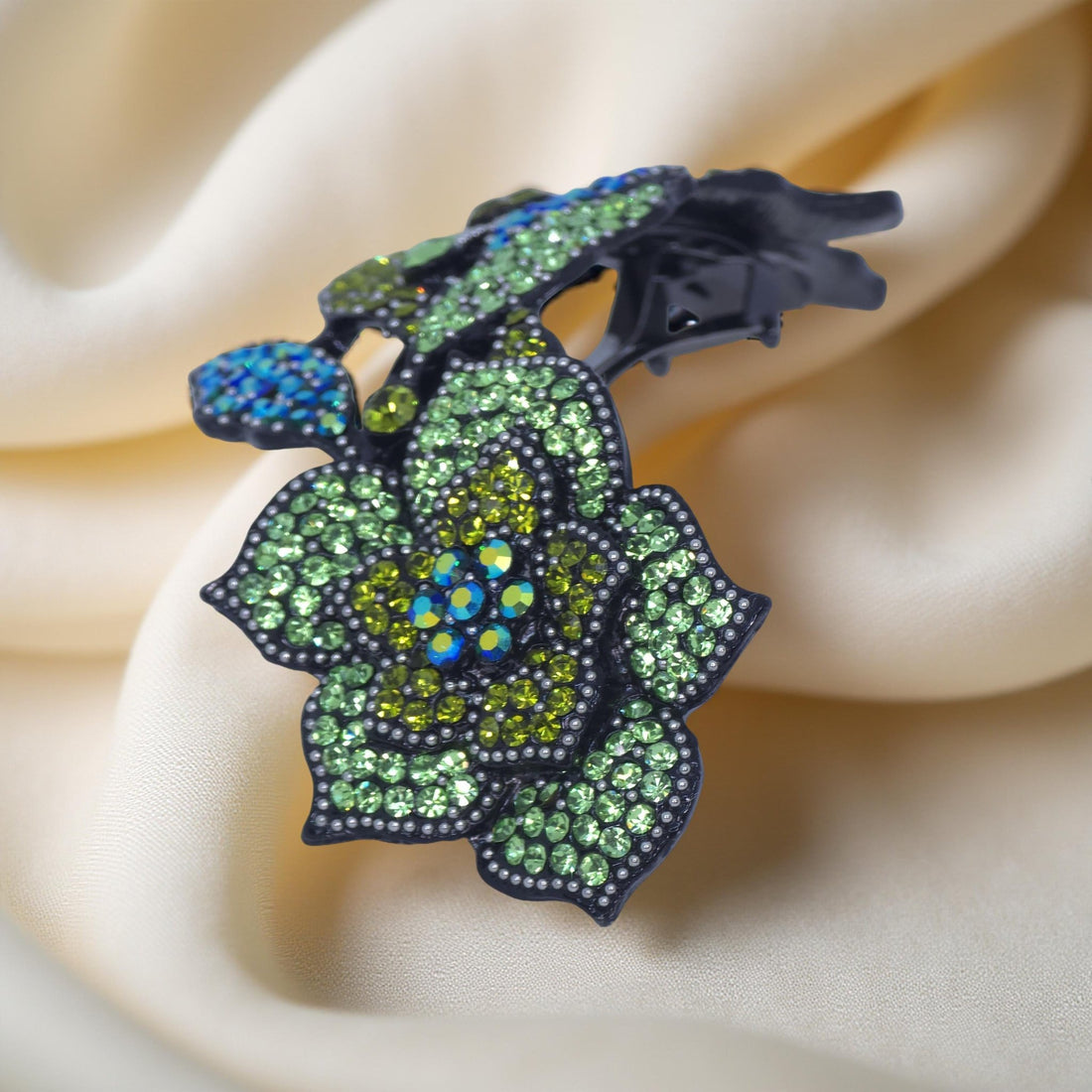 Haerime Midnight Bloom Barrette in Mint – side view showing arched silhouette and layered bloom motif, reflecting soft shimmer