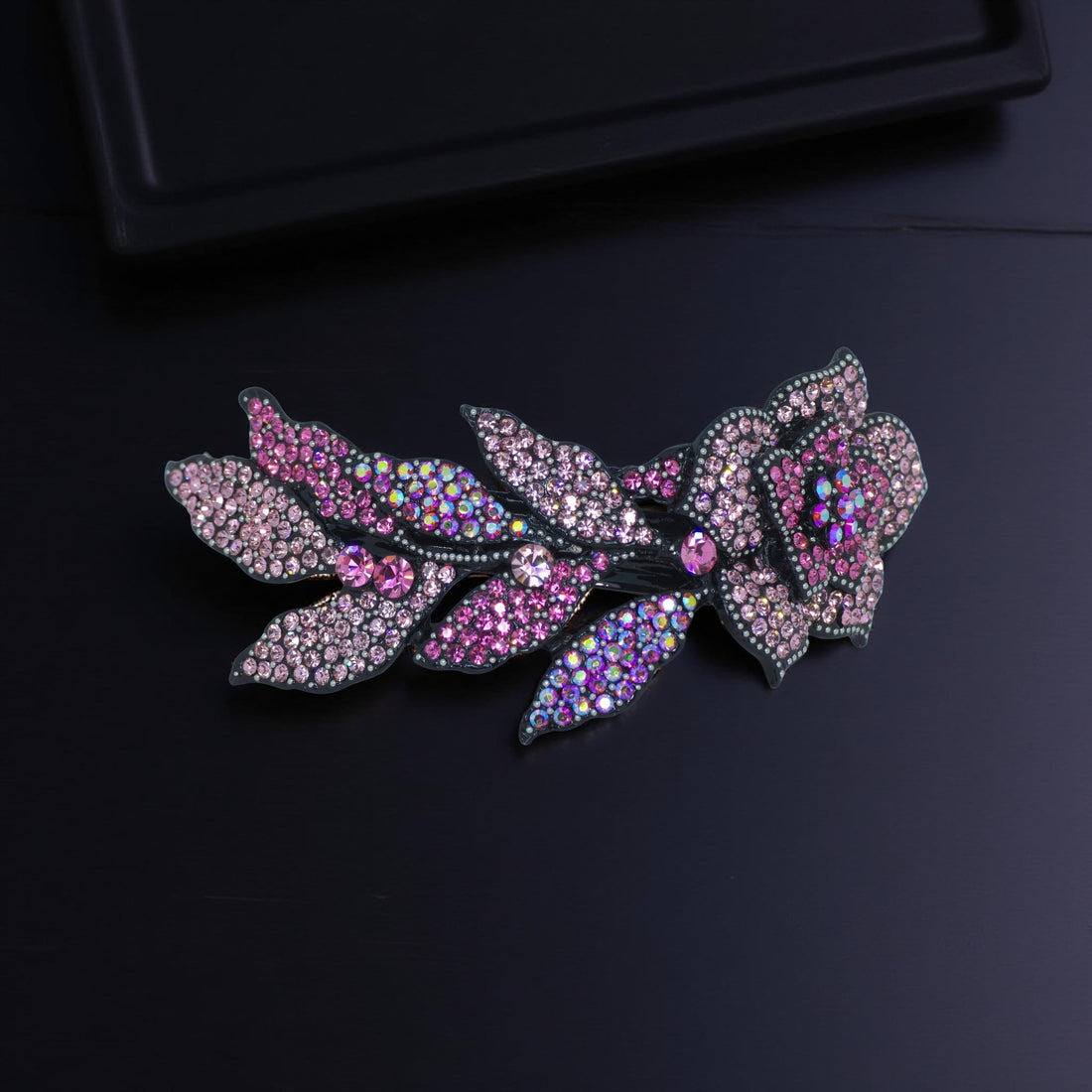 Haerime Midnight Bloom Barrette in Pink – zoomed-in image showing rose crystal petals and soft curved silhouette