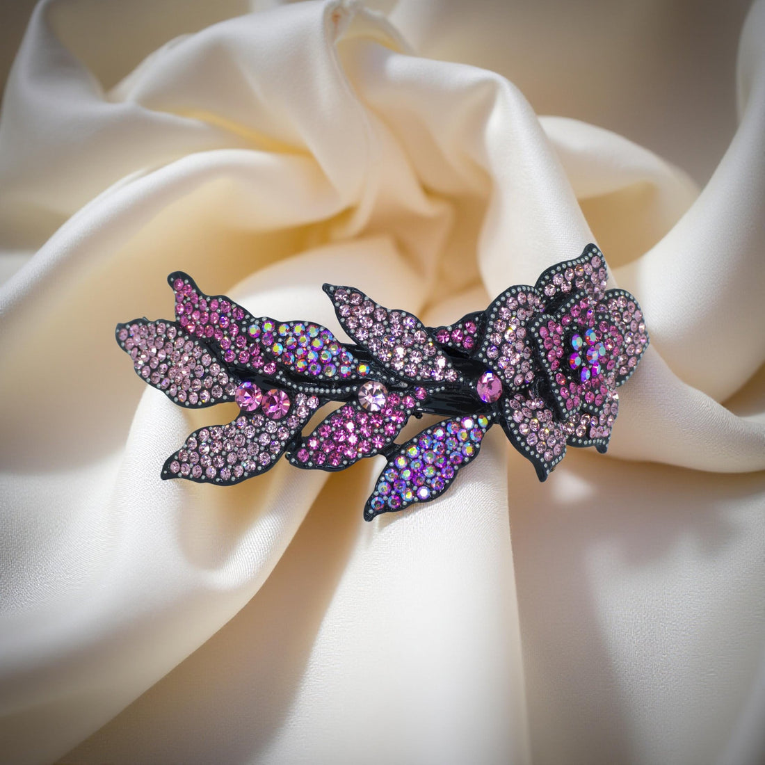 Haerime Midnight Bloom Barrette in Pink – blush-toned floral arc shown on pale velvet background