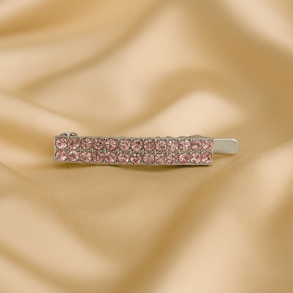 Haerime Minette Magnet Clip in Pink – slim crystal bar with blush pavé, shown on cream satin with natural shadows