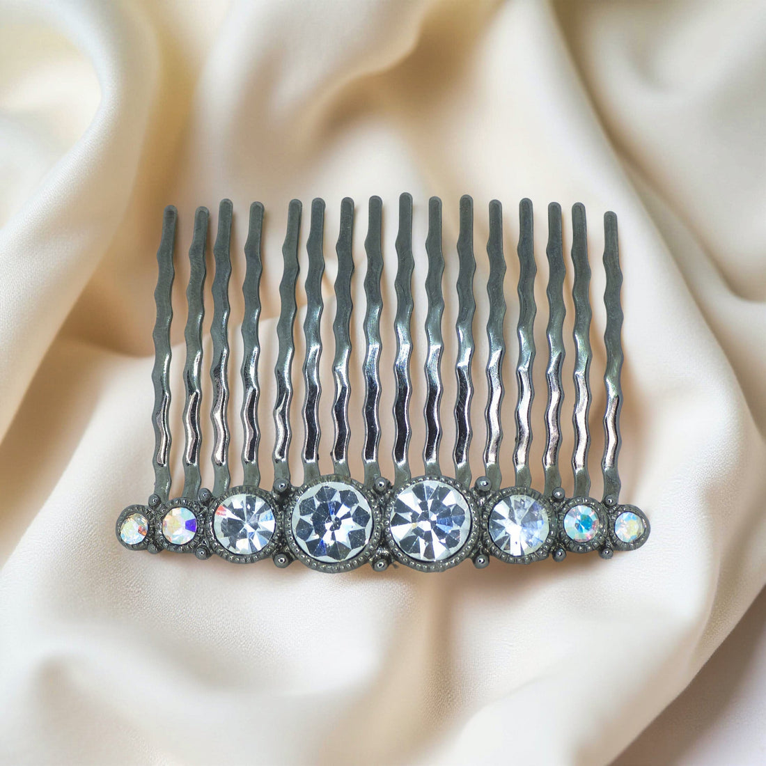 Haerime Ornette Classic Comb in Clear – flat lay of shimmering clear crystals set on bright antique comb base