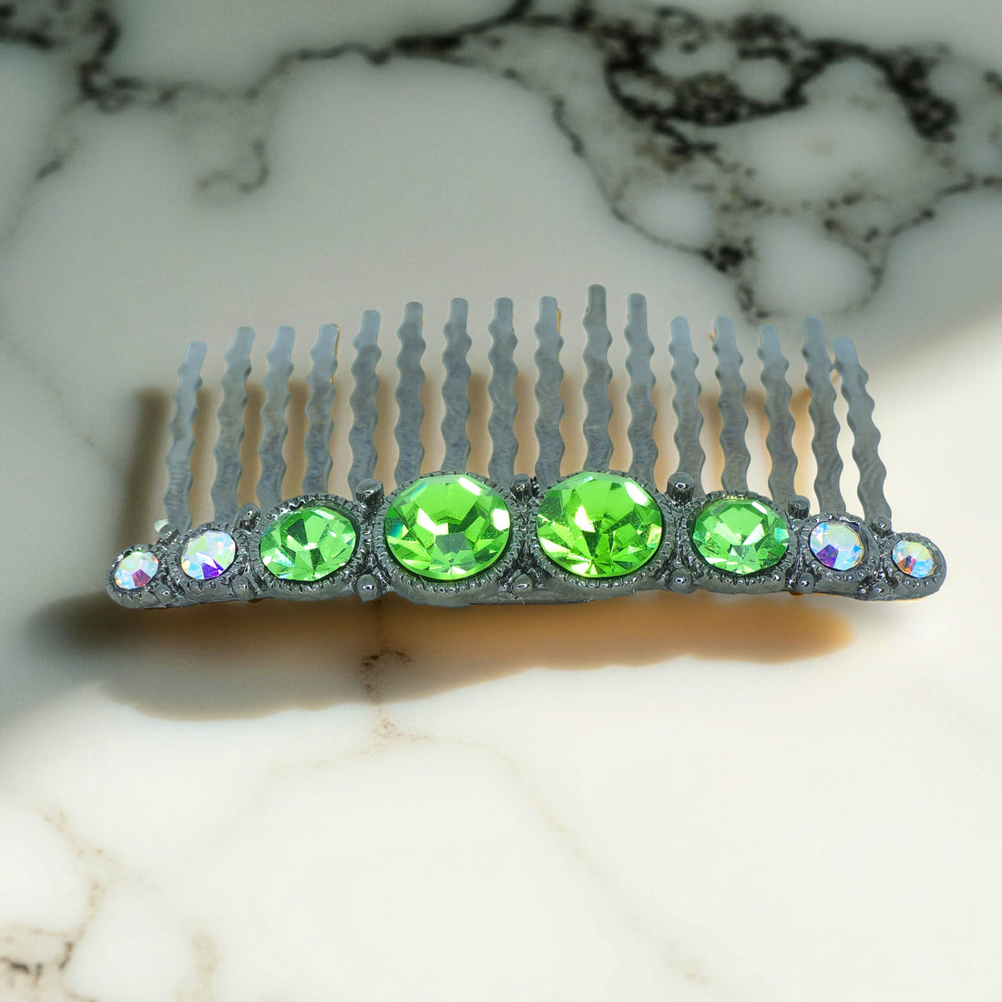 Haerime Ornette Classic Comb in Peridot – lime green crystal row with antique silver finish on wave-tooth comb