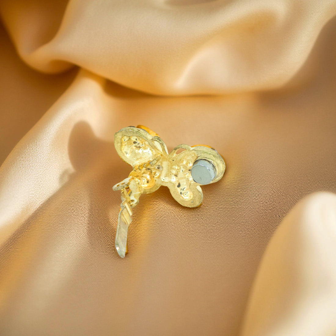 Haerime Papillon Éclat Clip in Amber – rear view showing arched magnetic clasp and metallic butterfly spine