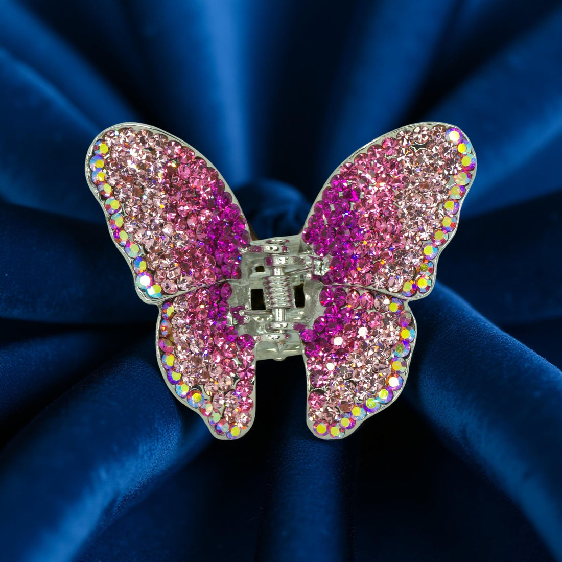 Haerime Papillora Mini Claw in Pink – blush-toned butterfly clip placed on pale ivory velvet in natural morning light