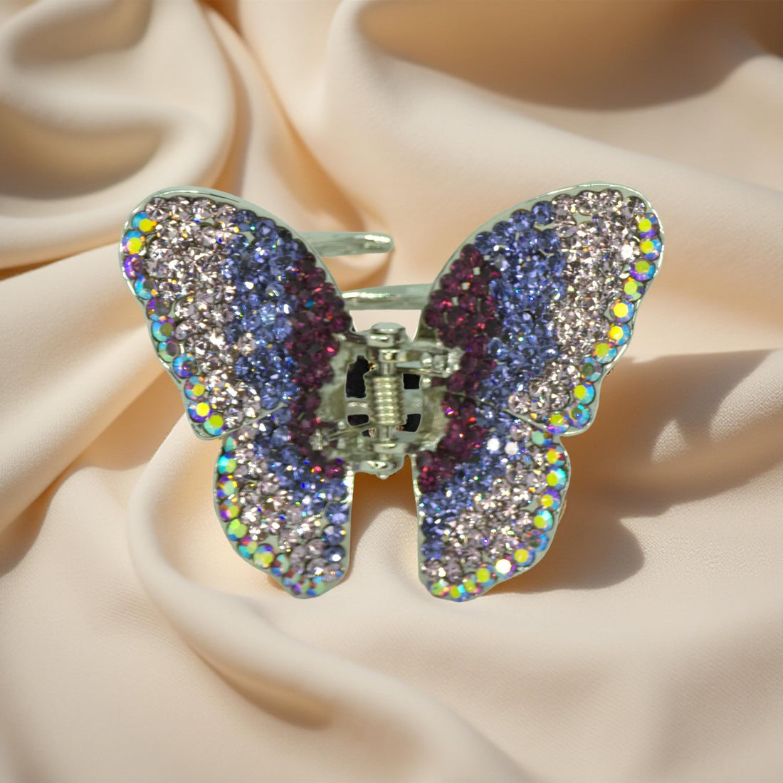 Haerime Papillora Mini Claw in Purple – lavender crystal butterfly shown on soft blush satin under soft bounce light