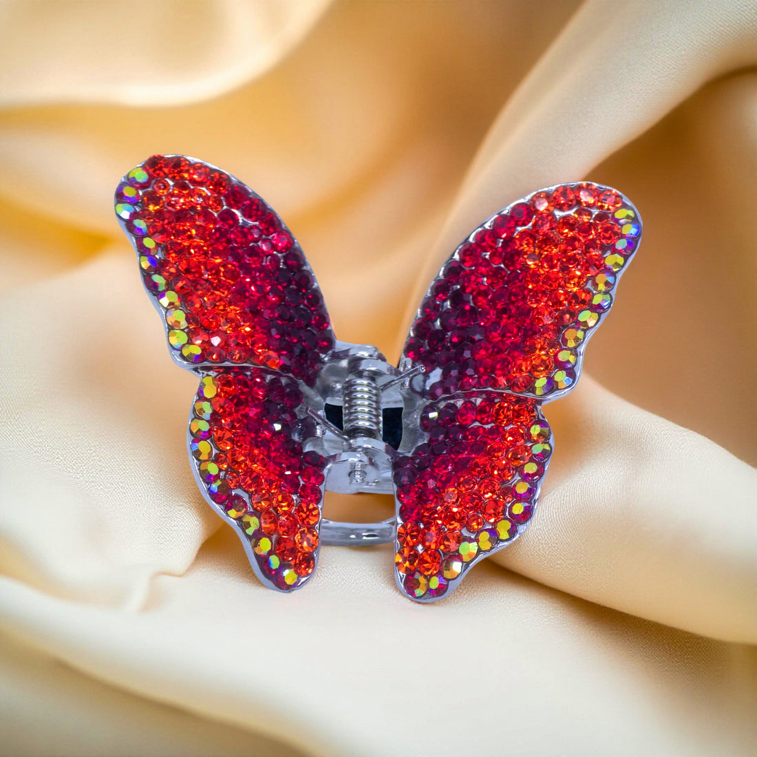 Haerime Papillora Mini Claw in Red – ruby ombré butterfly clip on champagne satin with warm studio lighting