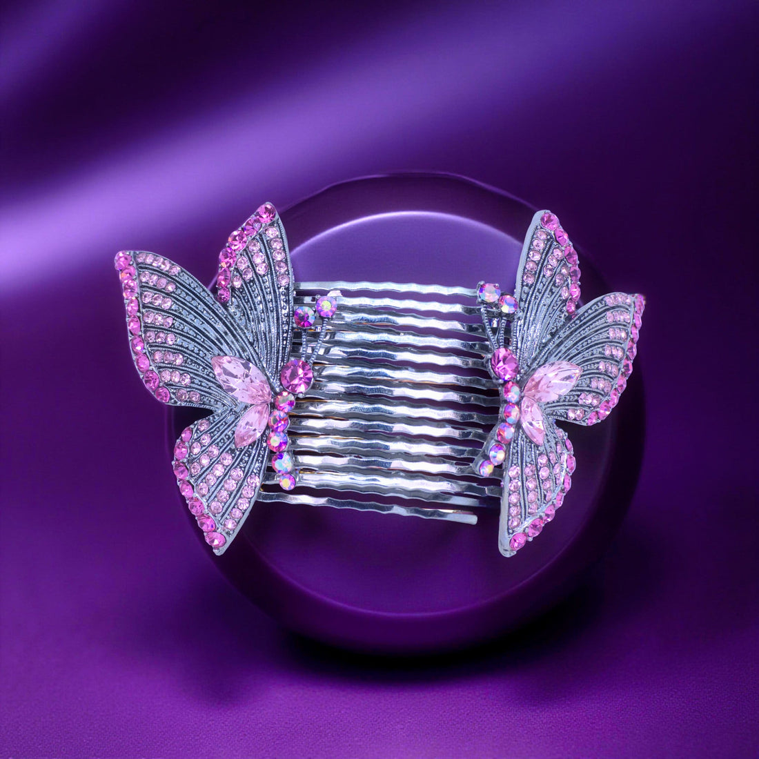 Haerime Papillora Twin Comb Set in Pink – pastel crystal wings arranged on blush velvet pouch under soft studio lighting