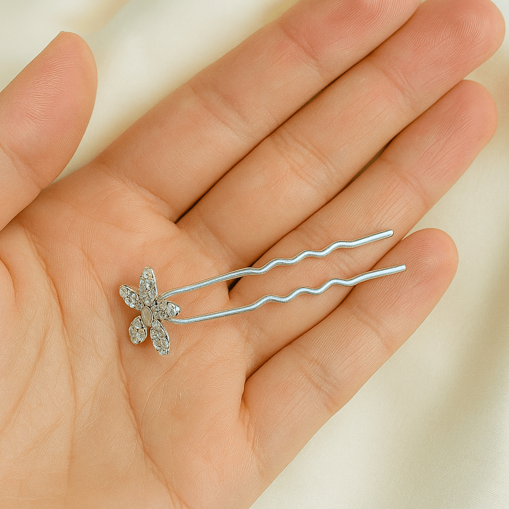 Haerime Petalight Hair Stick in Clear – placed delicately on model’s open hand over neutral background with natural daylight