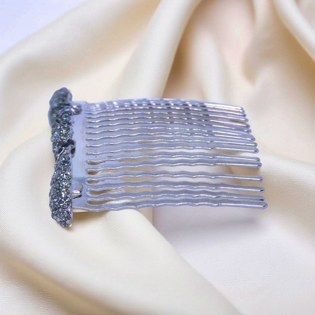Haerime Seraphine Twist Comb in Black – side view showing twisted black crystals and wave teeth over satin folds