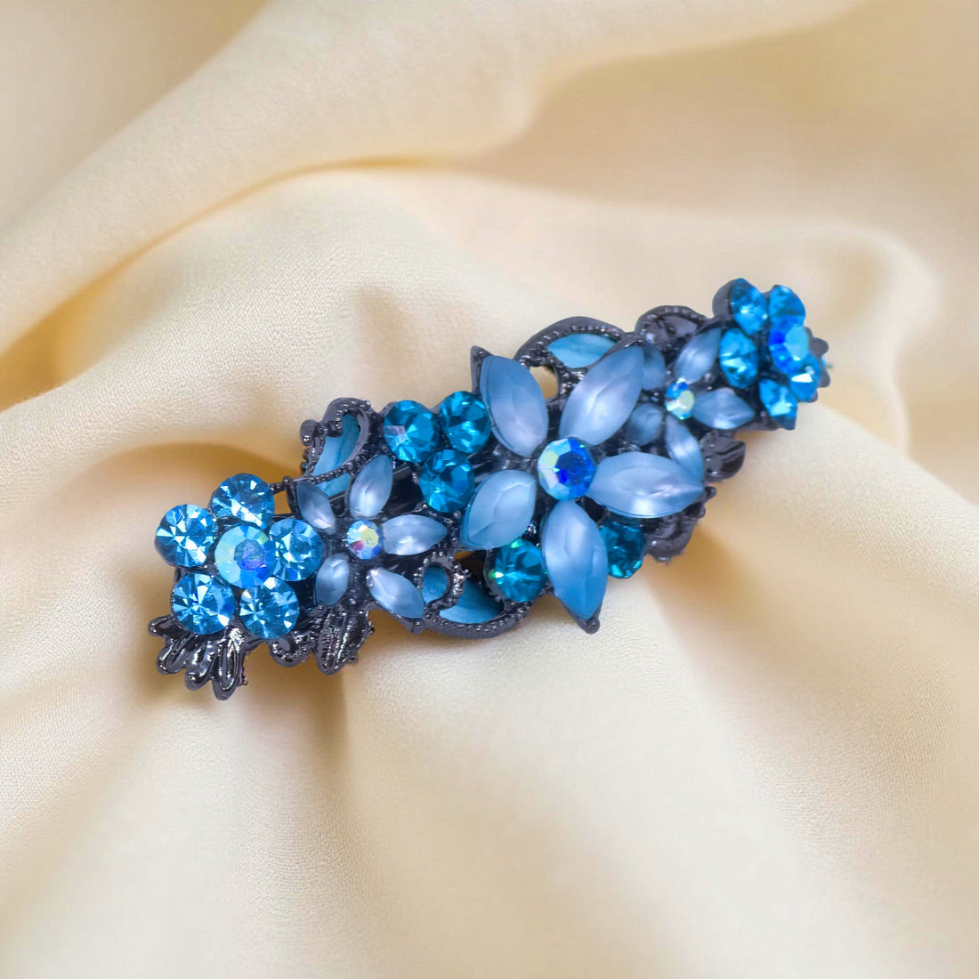 Haerime Serenbelle Bloom in Aquamarine – side angle showing light blue floral arc with marquise crystals on ivory satin