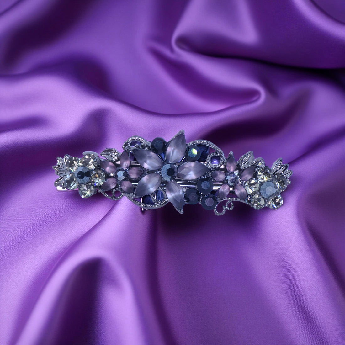 Haerime Serenbelle Bloom in Purple – lilac floral barrette with marquise and round stones placed on ivory velvet