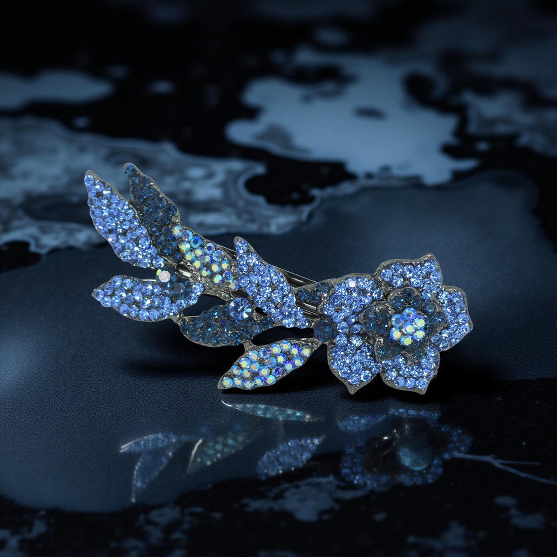 Haerime Twilight Bloom Mini in Blue – deep sapphire floral barrette on ivory satin background in soft bounce light