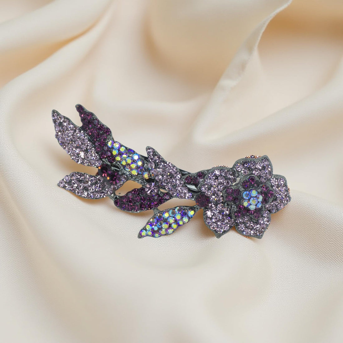 Haerime Twilight Bloom Mini in Purple – full comb shown on cream velvet with lilac gem cluster arrangement