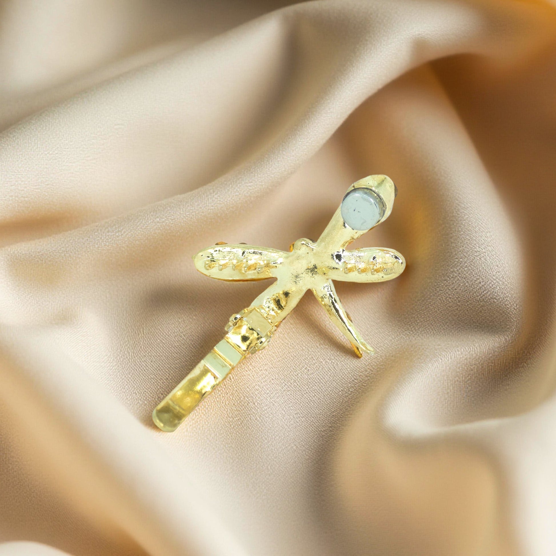 Back view of Haerime Aeris Wing Clip – hidden magnetic clasp design in amber

