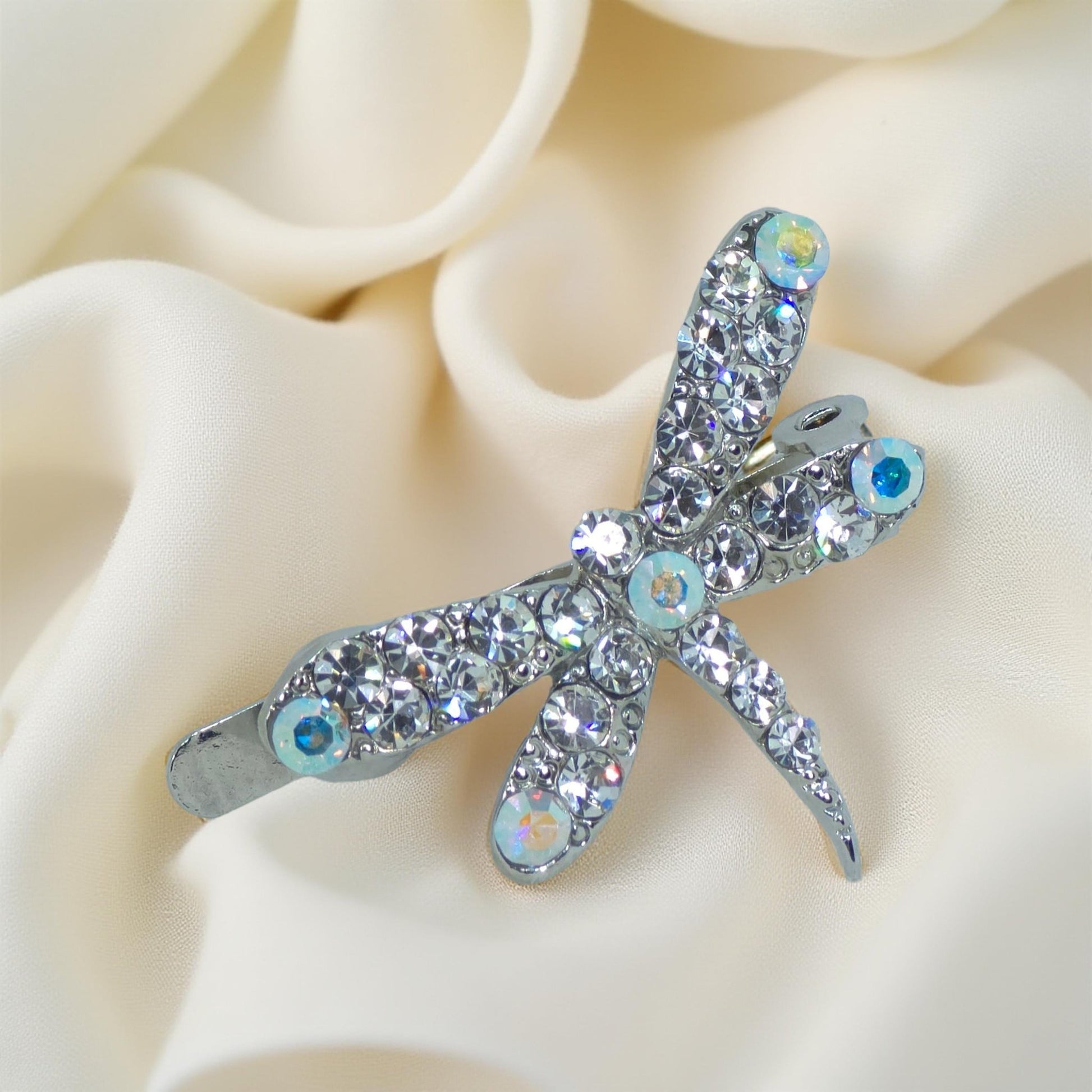 Close-up of hand-set clear rhinestones on Haerime Aeris Wing Clip with dragonfly wings