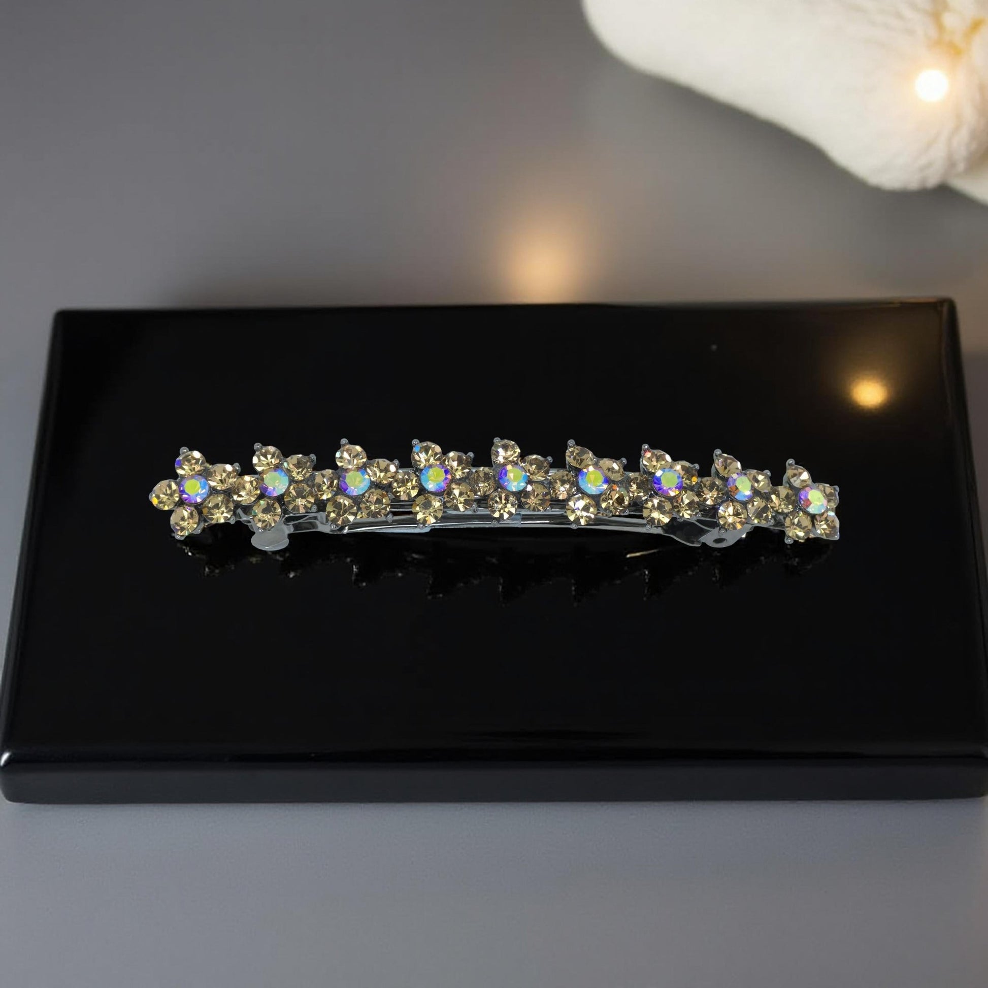Haerime Aureflor Arc Barrette in Amber close-up – golden rhinestones in floral arc pattern on burnished base