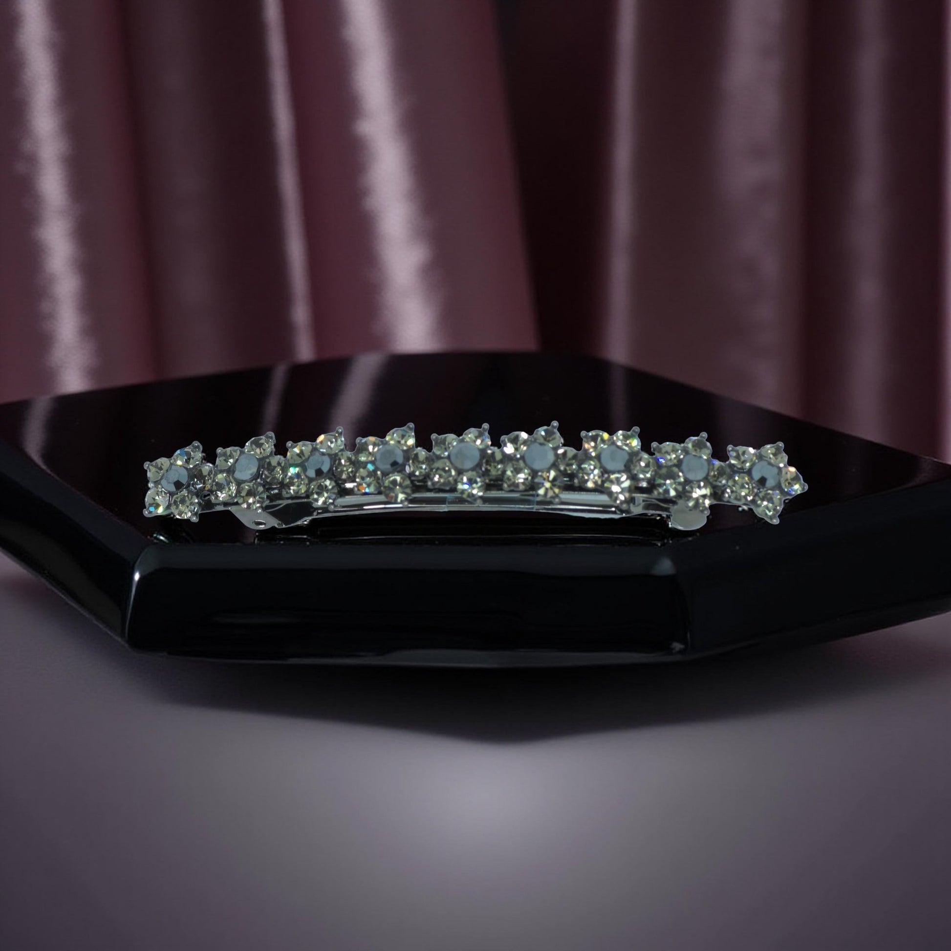Haerime Aureflor Arc Barrette in Black close-up – dark floral motif with layered crystal alignment