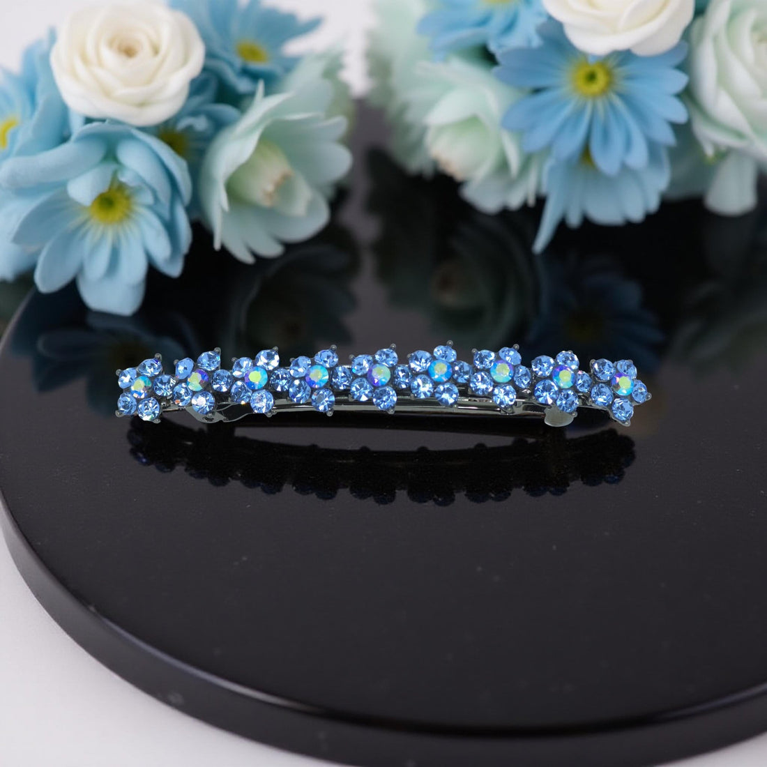Haerime Aureflor Arc Barrette in Blue close-up – crystal petal alignment and antique metal curve in gloss finish