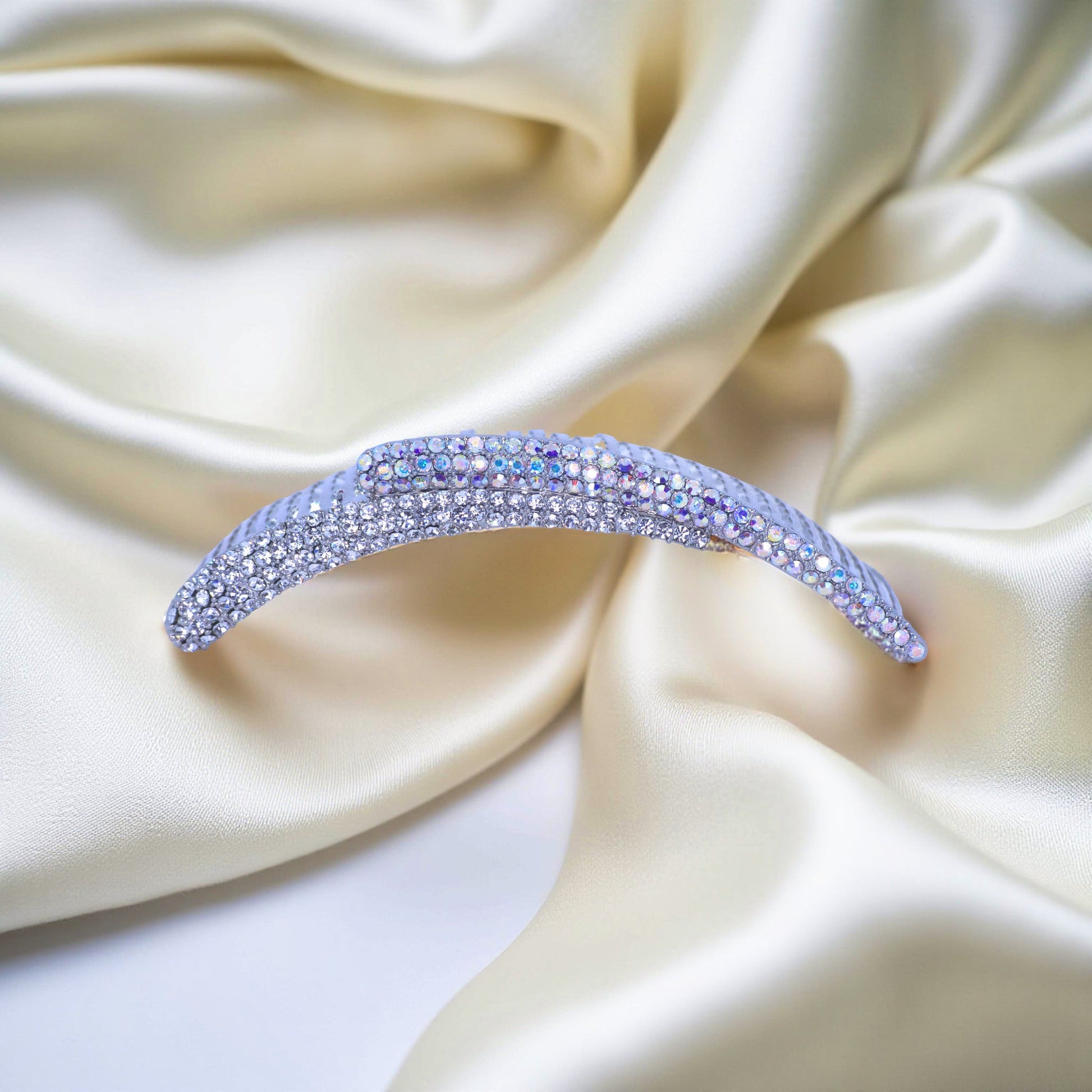 Haerime Aurelya Dual Arc Comb in Clear showing curved pavé design and dual arc silhouette