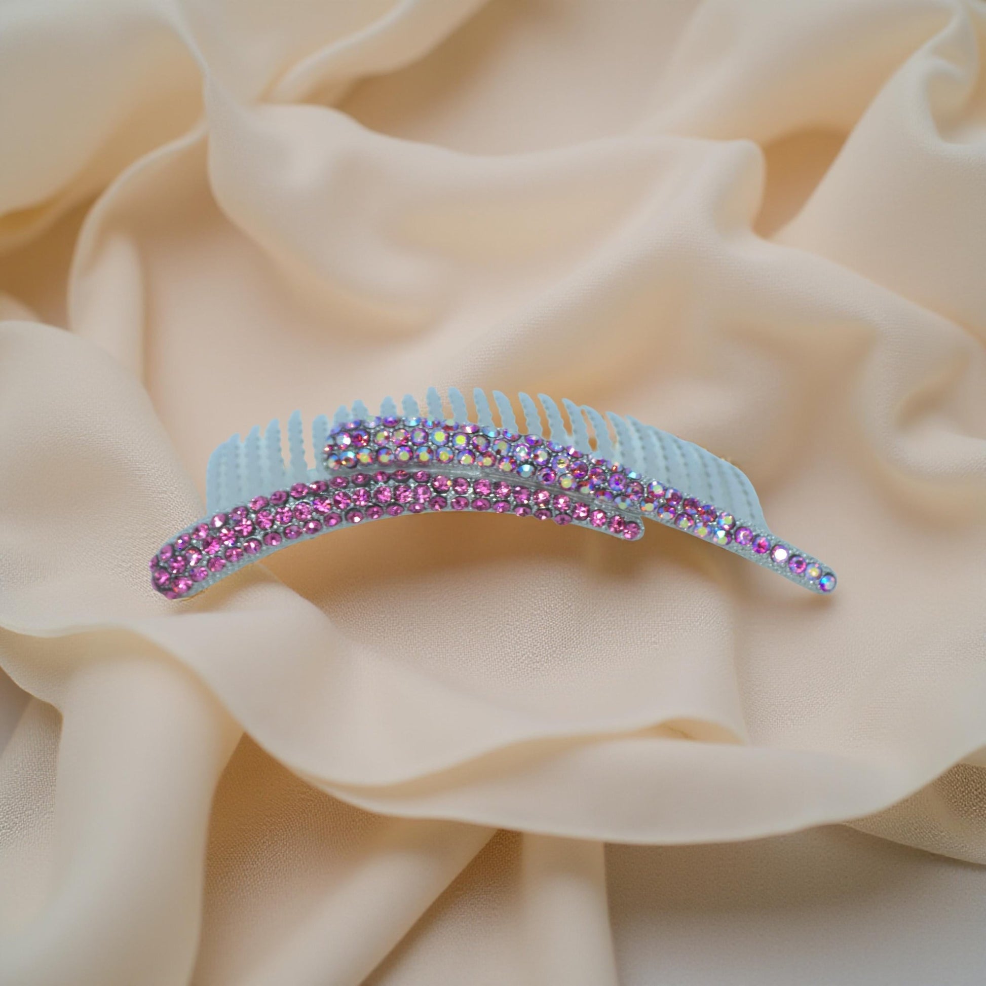 : Haerime Aurelya Dual Arc Comb in Fuschia showing curved pavé design and dual arc silhouette