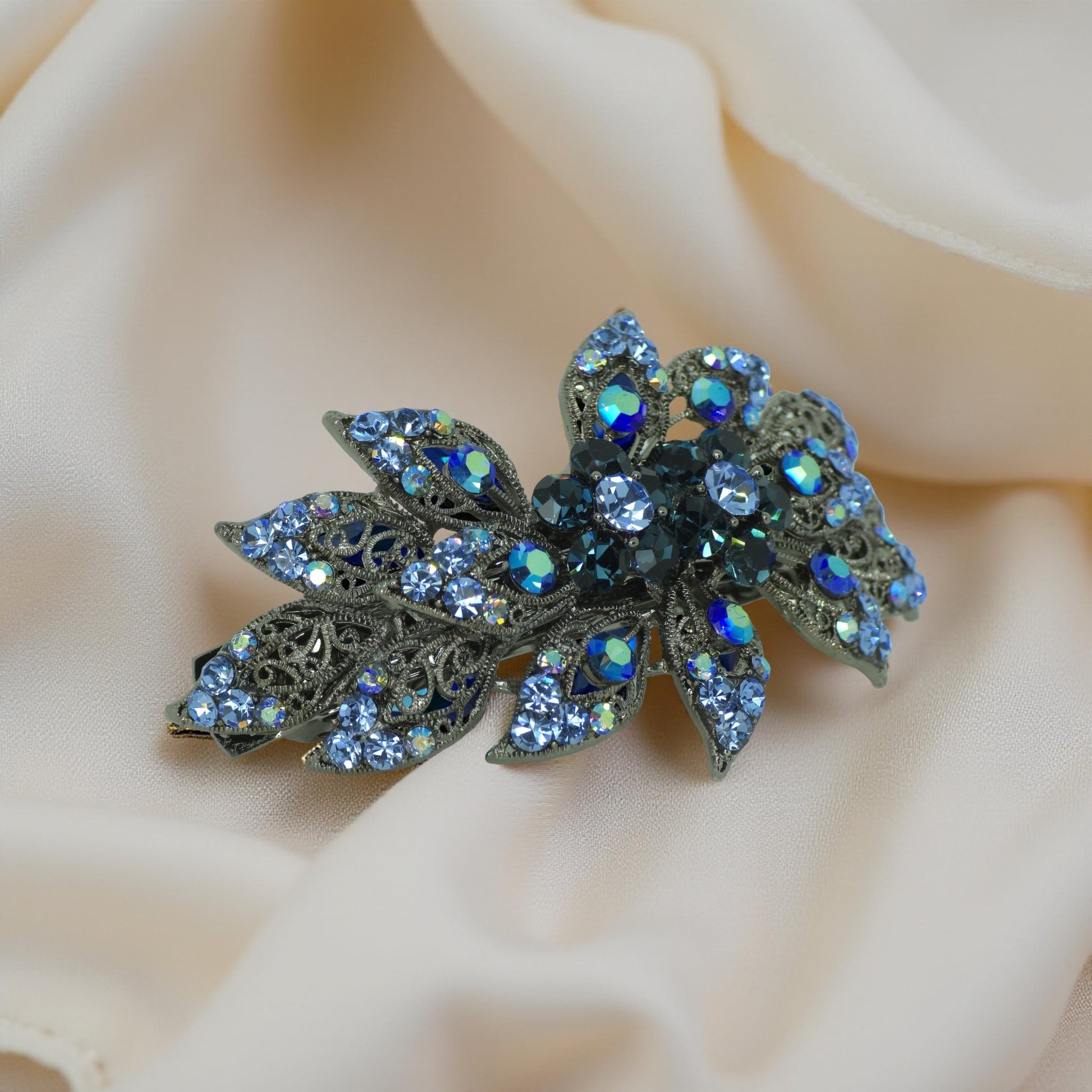 Haerime Aurora Filigree Barrette in Blue showing antique lace petal detail and clustered Austrian crystals