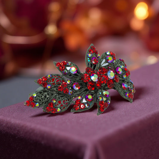 Haerime Aurora Filigree Barrette in Red – vintage floral lace design with radiant crystal center on velvet background