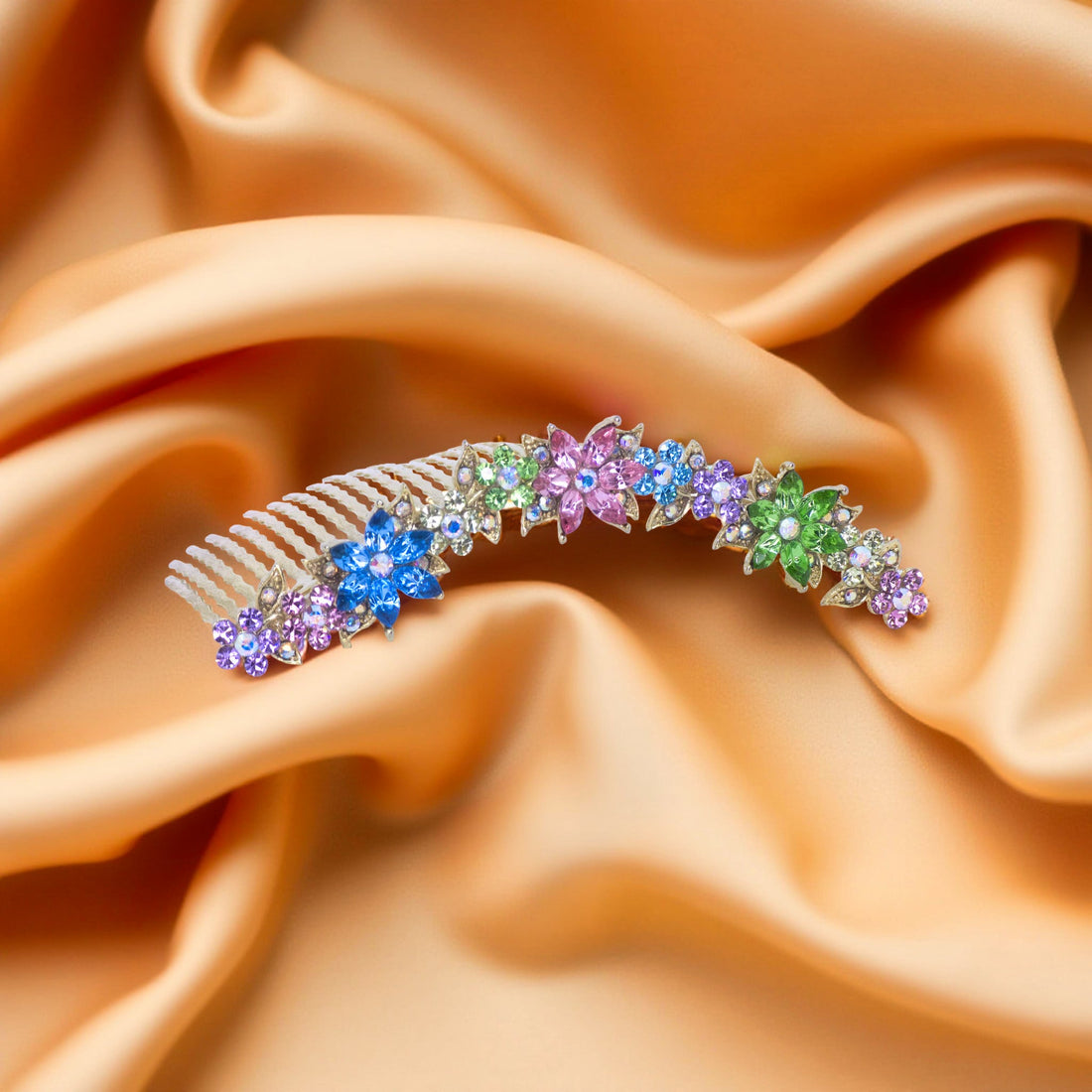 Haerime Celestara Crown Comb in Rainbow detail view – layered petal crystals and scroll base