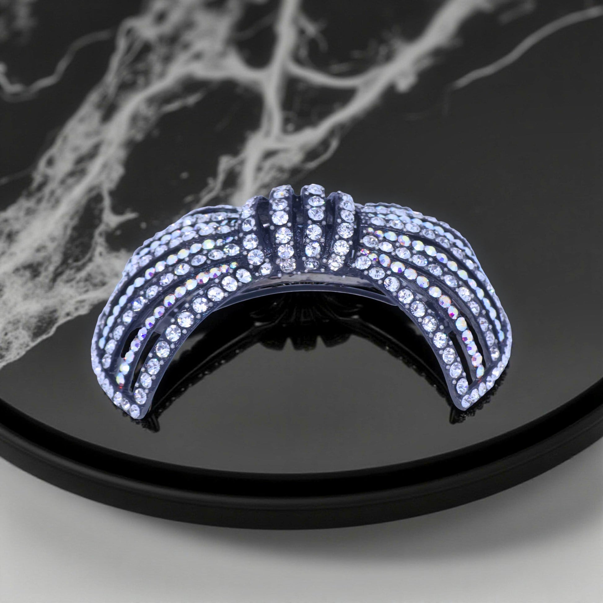 Horizontal side view of Haerime Celestial Ribbons Barrette in Clear – elegant open ribbon curvature