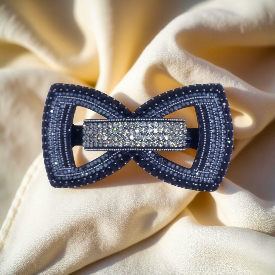 Black version of Haerime Ecliptique Bow – midnight gloss crystal barrette with dimensional bow shape