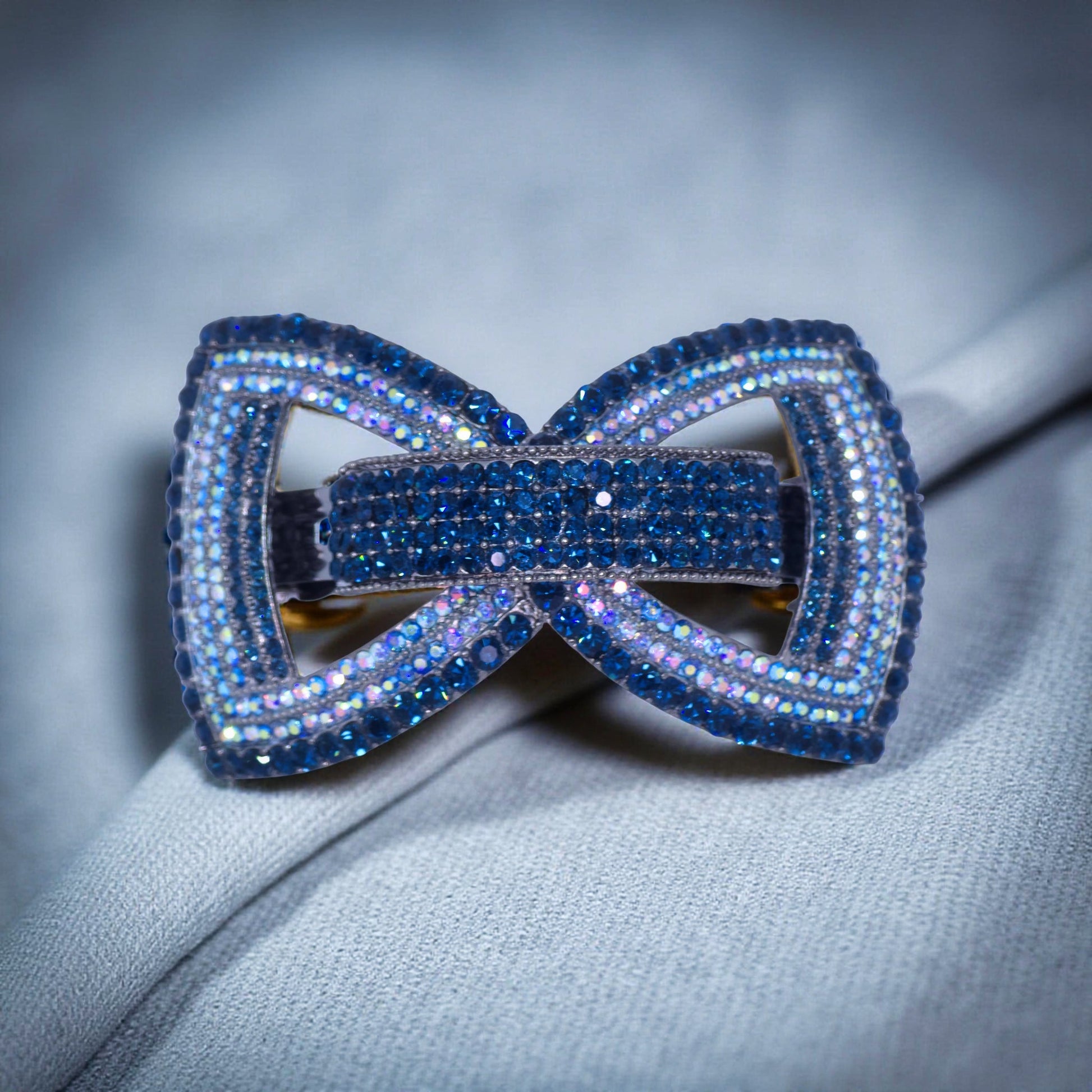 Haerime Ecliptique Bow in Blue close-up – sculpted crystal double bow with dramatic layered pavé shine