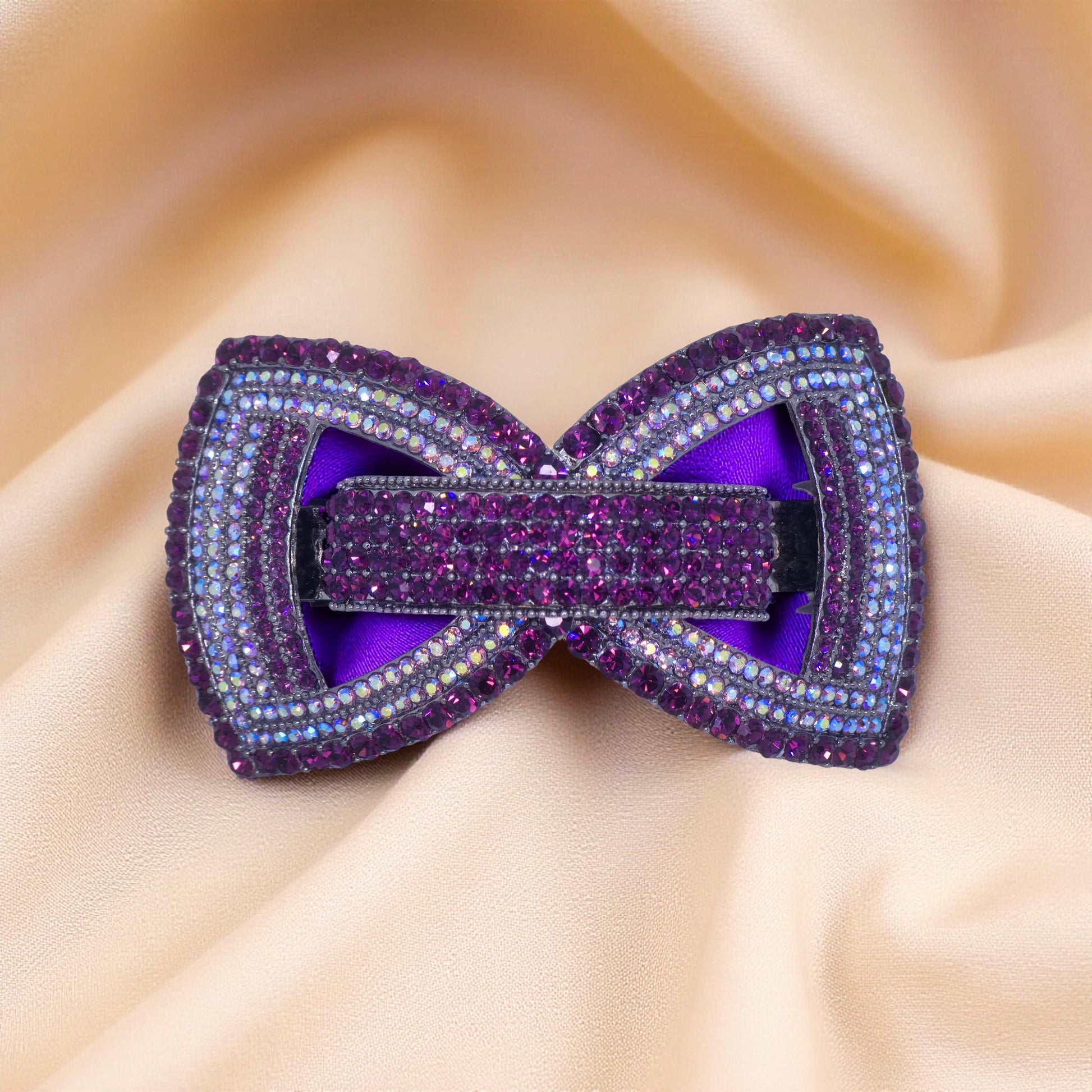 Haerime Ecliptique Bow in Purple close-up – pavé crystal bow on gloss violet enamel