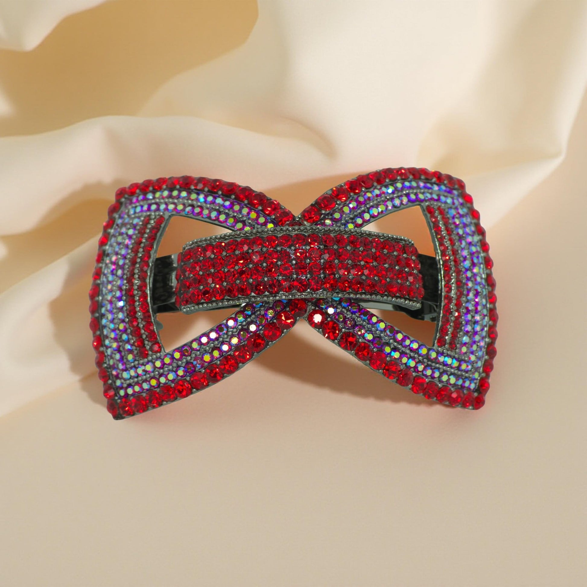 : Haerime Ecliptique Bow Barrette in Red close-up – pavé crystal layers on gloss enamel surface showing sculpted couture structure