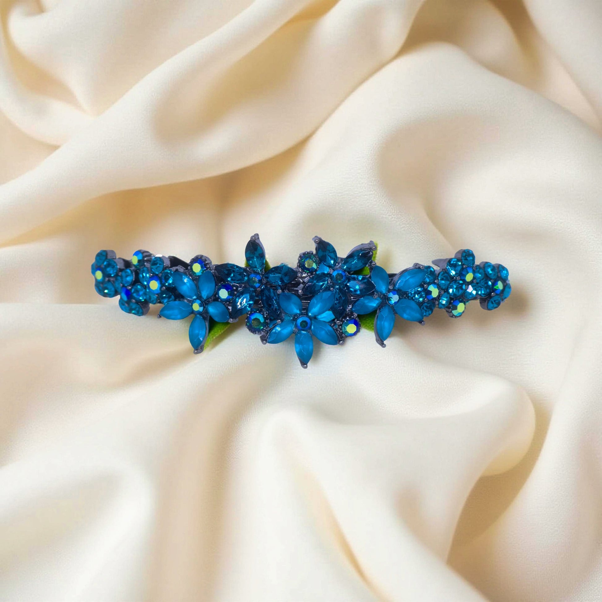 Haerime FleurVerre Cascade Barrette in Blue Zircon close-up – hand-set clustered petals, oxidized silver leaf base, and layered sparkle