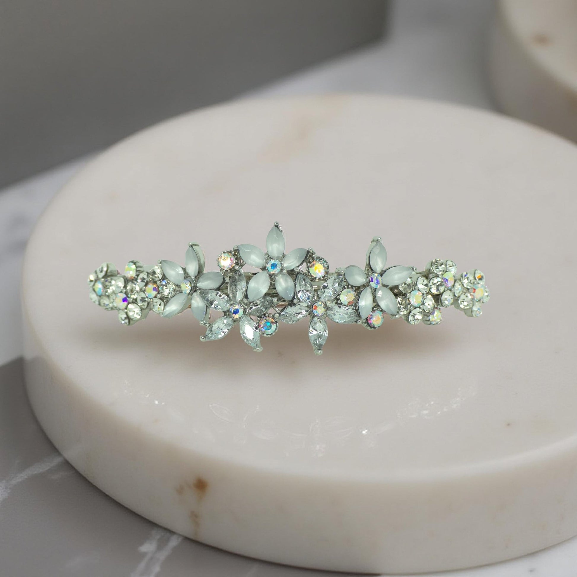 Haerime FleurVerre Cascade Barrette in Clear close-up – shimmering clustered crystals over antique silver curve