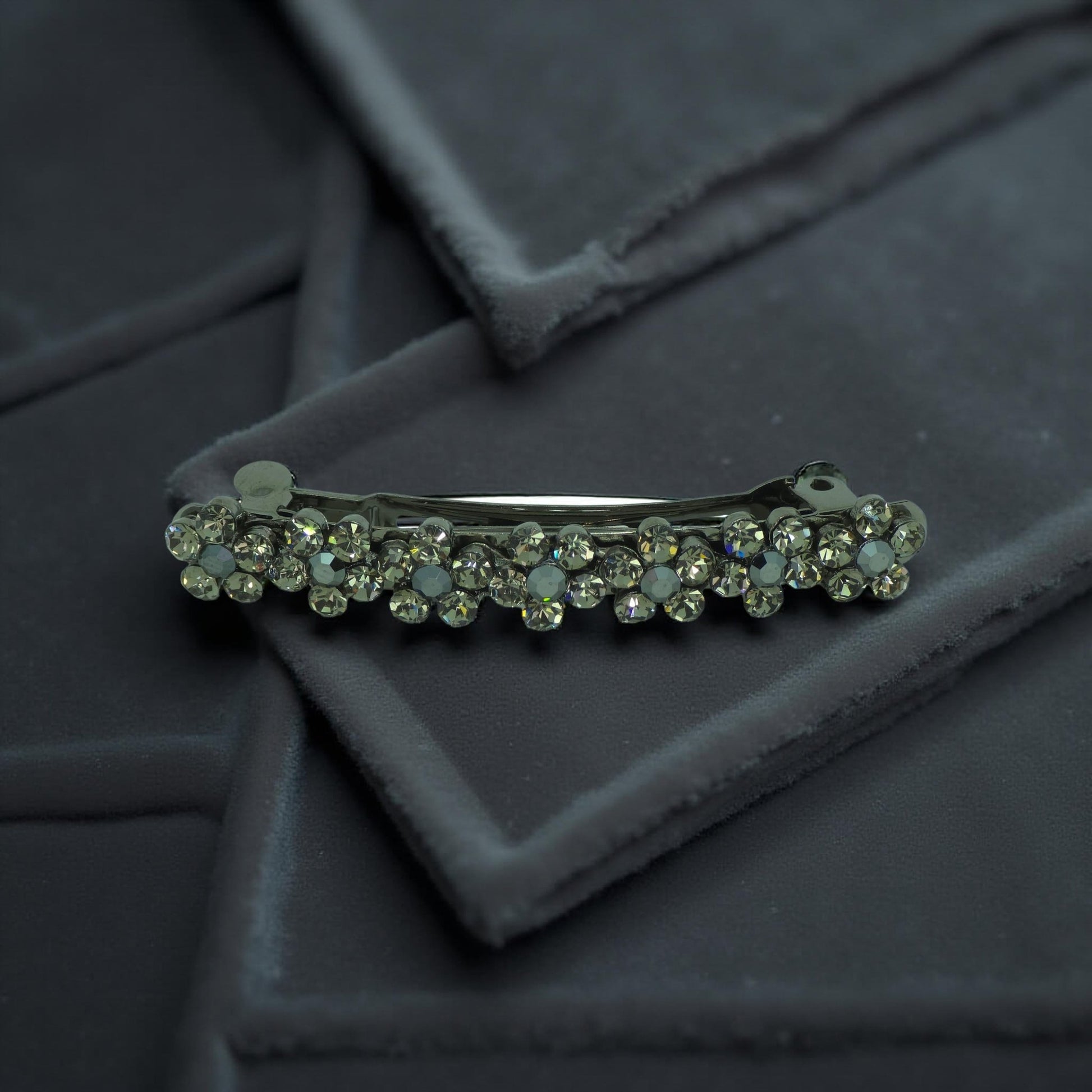 Haerime FloraDot Row Barrette in Black close-up – glossy floral texture with layered depth