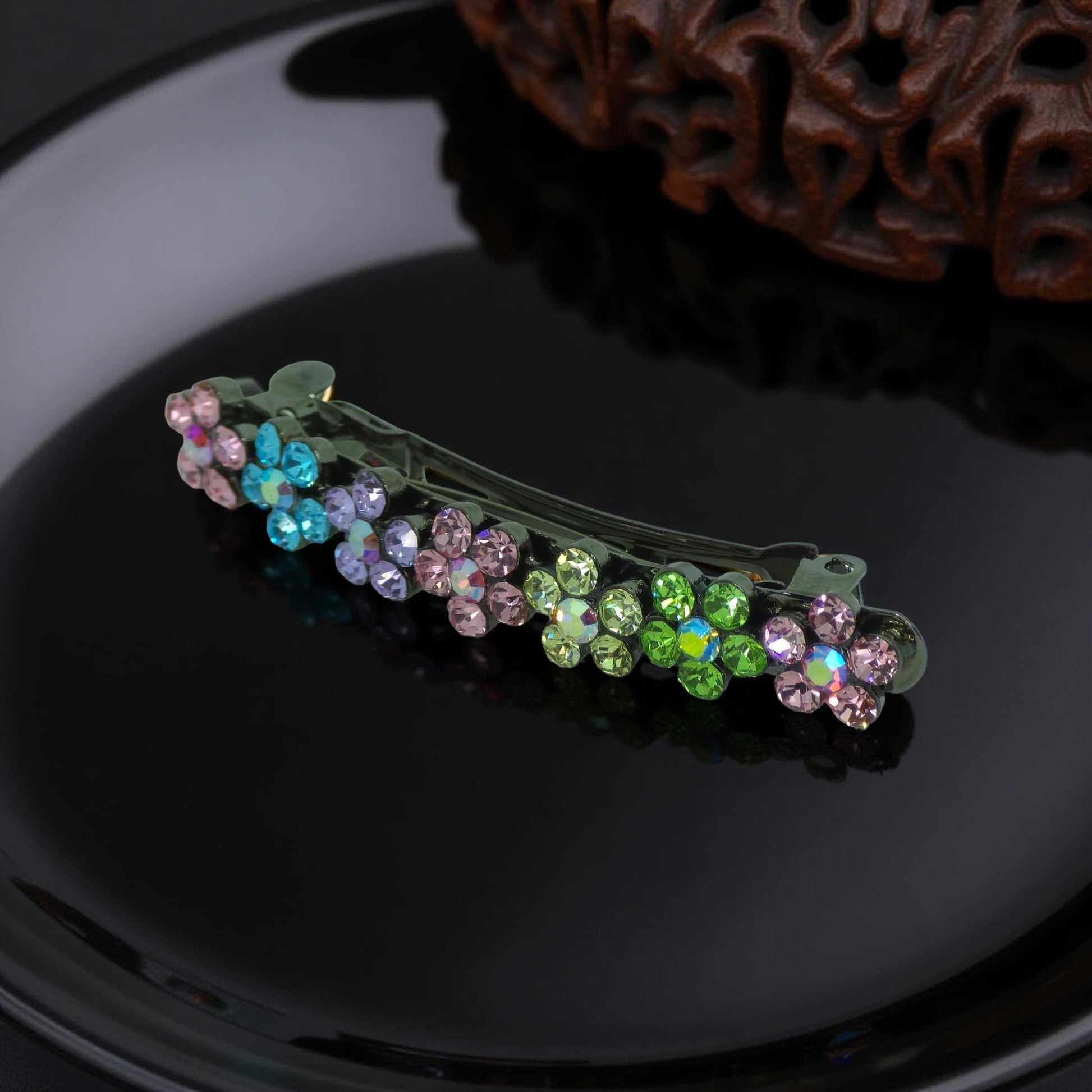 : Haerime FloraDot Row Barrette in Rainbow angled view – showing profile height and layered crystal reflection