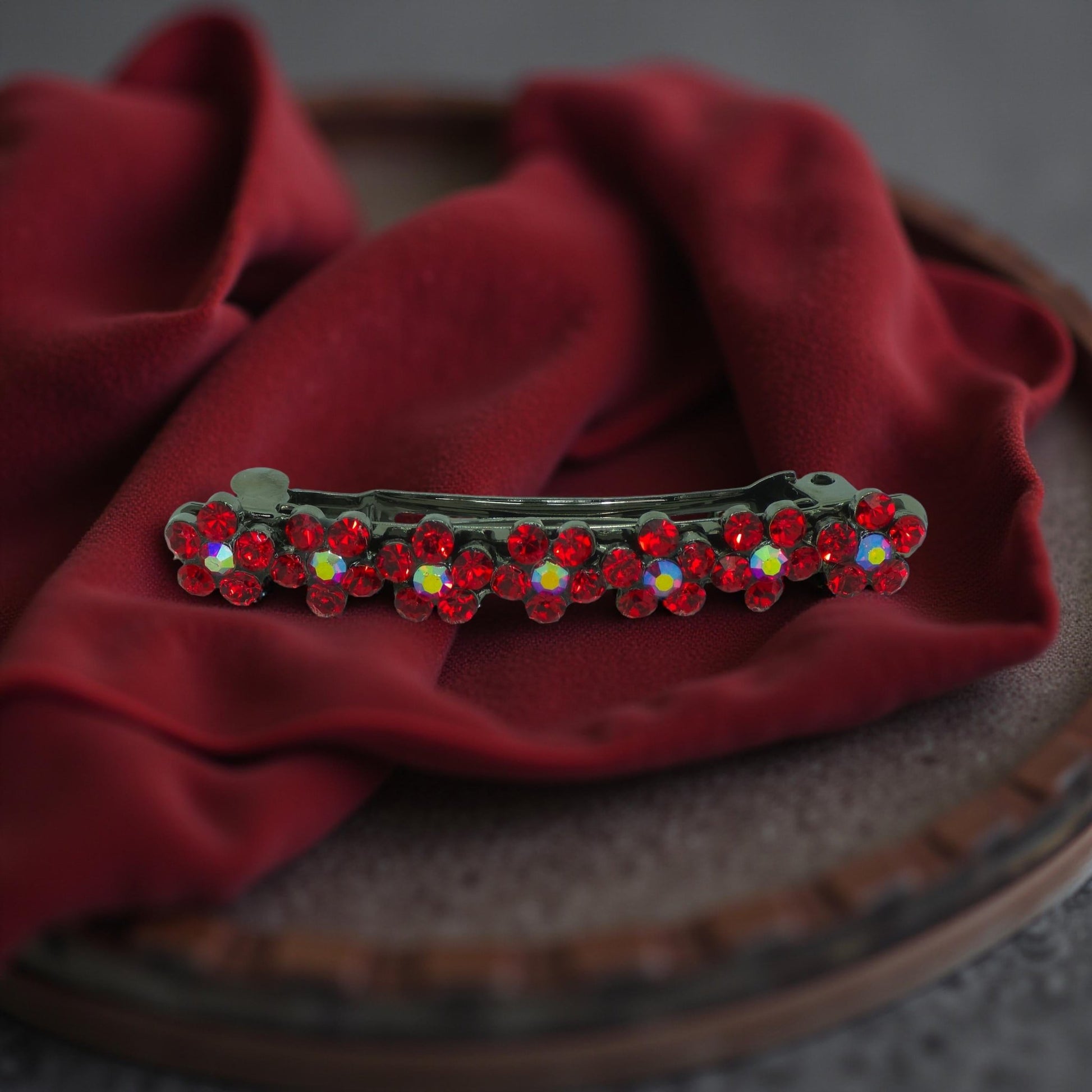 Haerime FloraDot Row Barrette in Red close-up – fire-red rhinestones arranged in floral arcs