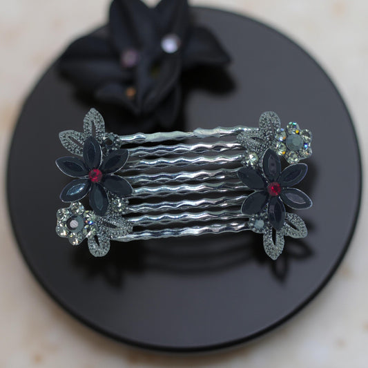 Haerime Florelle Petite Pair Combs in Black – paired floral crystal mini combs displayed on black velvet with asymmetrical marquise bloom design