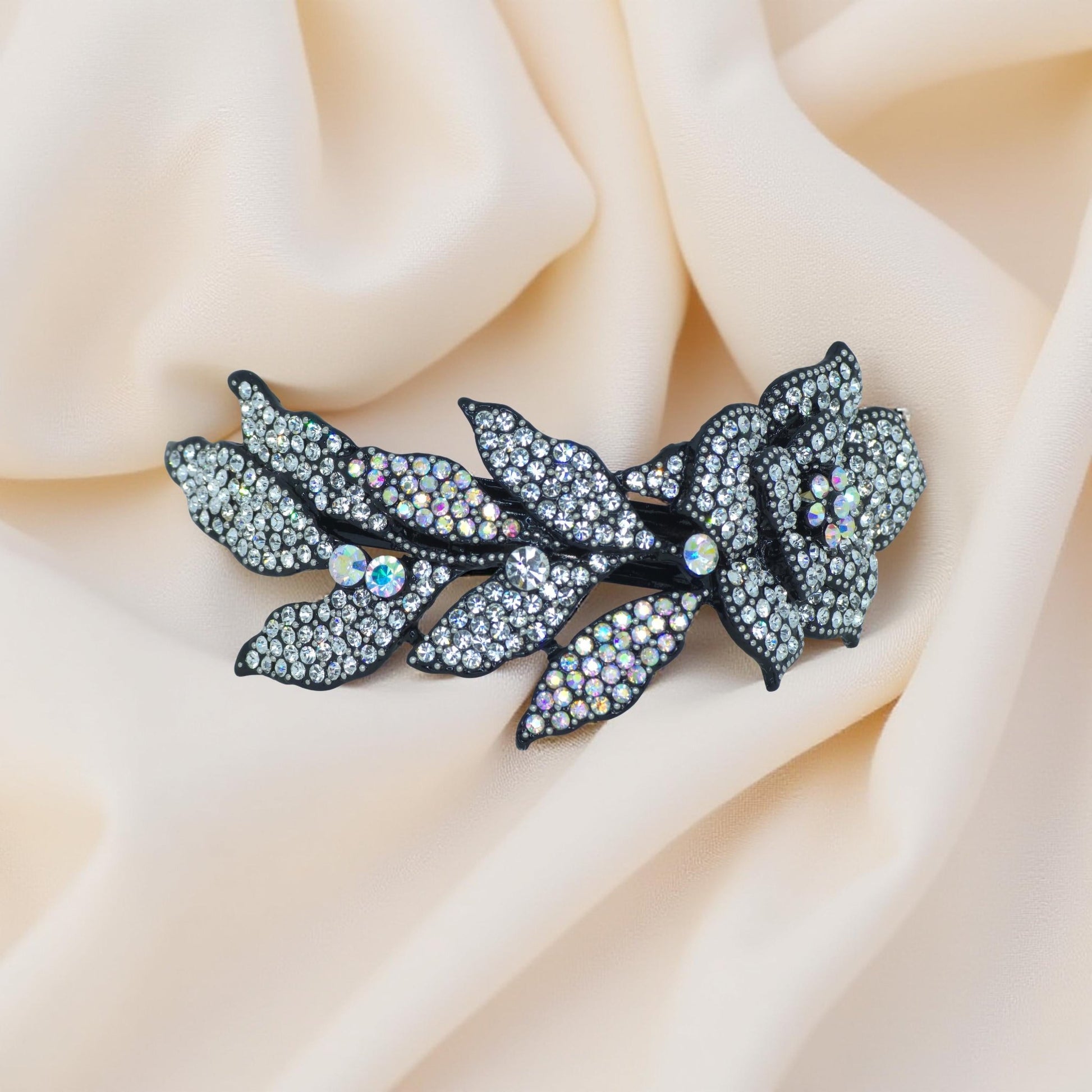 Haerime Midnight Bloom Barrette in Clear – close-up highlighting brilliant clear pavé petals with frosty silver leaf accents