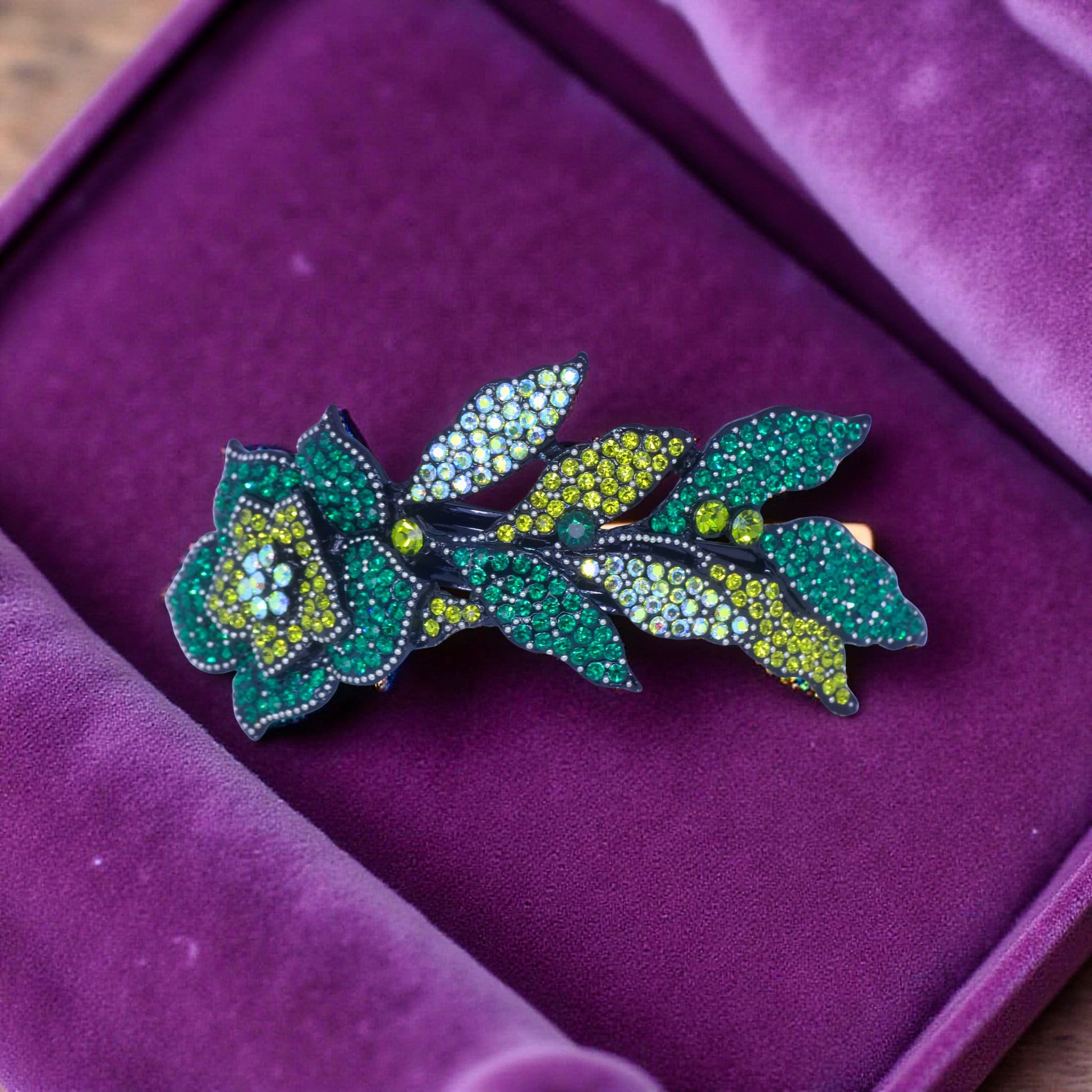Haerime Midnight Bloom Barrette in Green – close-up of emerald-toned petals and pavé leaf pattern with rich botanical structure
