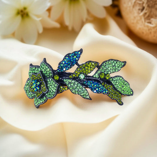Haerime Midnight Bloom Barrette in Mint – curved floral clip with aqua crystal leaves and mint petals, shown on ivory satin in soft daylight