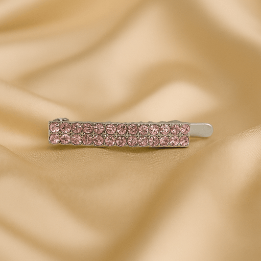  Haerime Minette Magnet Clip in Pink – slim crystal bar with blush pavé, shown on cream satin with natural shadows