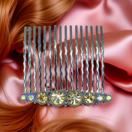 Haerime Ornette Classic Comb in Amber – symmetric crystal row comb with golden faceted stones, shown on rich velvet pouch in soft lighting