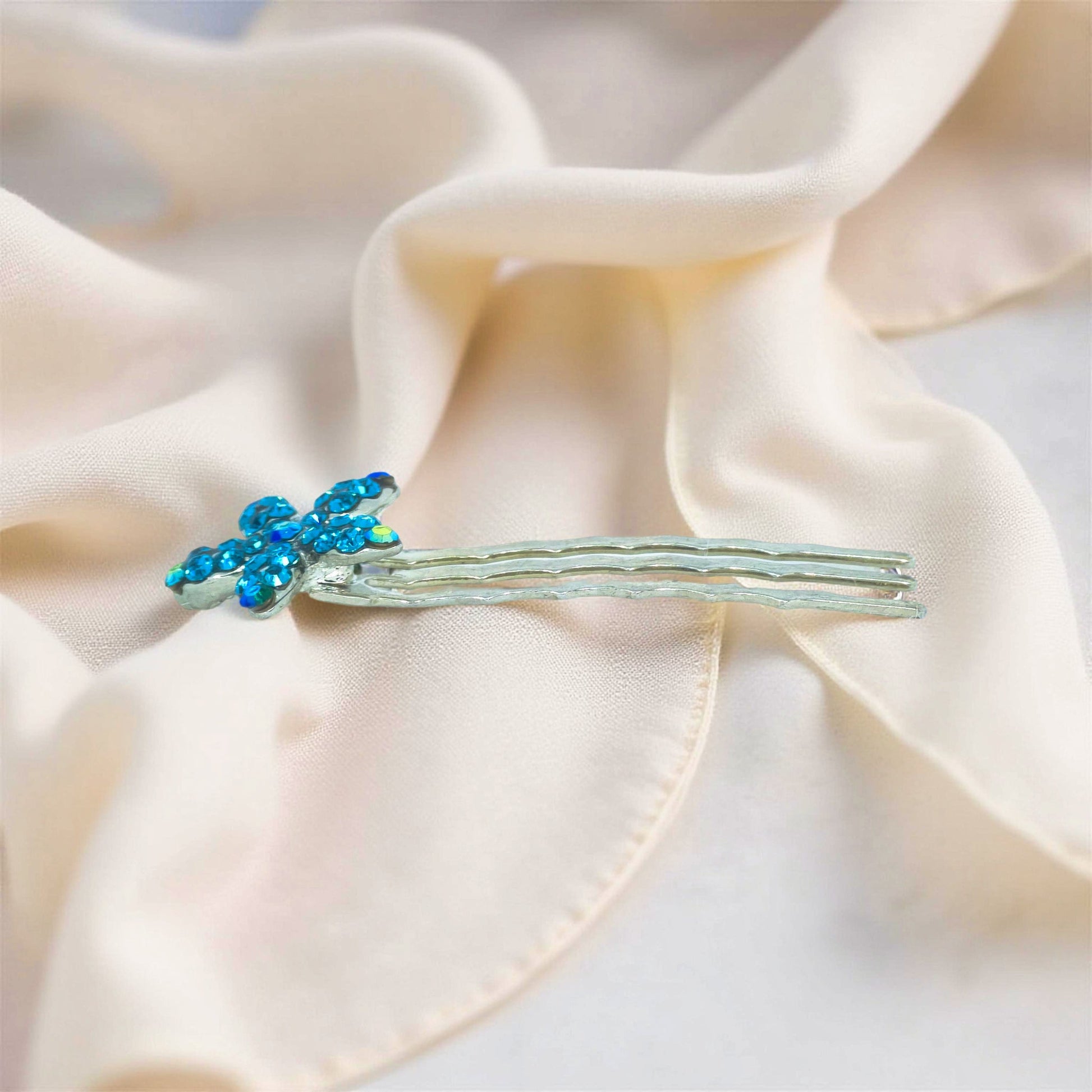 Haerime Starpetal Minis in Blue Zircon – side angle showing pronged mini comb and curved shimmer edge